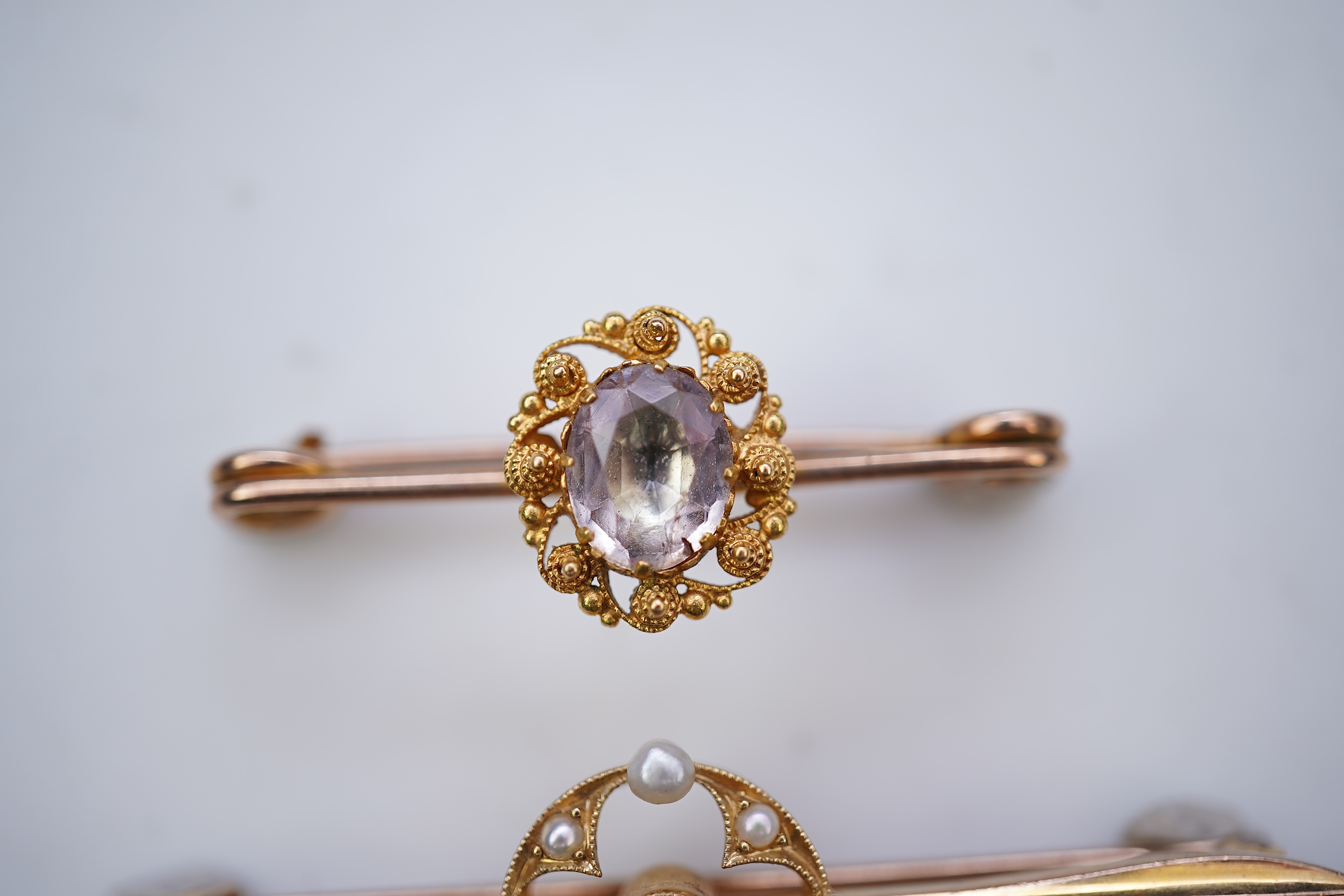 Four gold and gem-set bar brooches, early 20th century